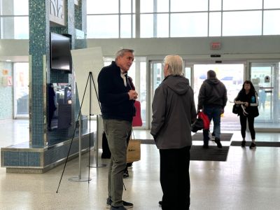 Image of Ken Todd speaking with a resident